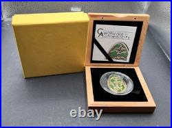 2013 Cook Islands $5 Imperial Egg in Cloisonné Easter in Olive. 999 Fine Silver