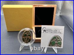 2013 Cook Islands $5 Imperial Egg in Cloisonné Easter in Olive. 999 Fine Silver